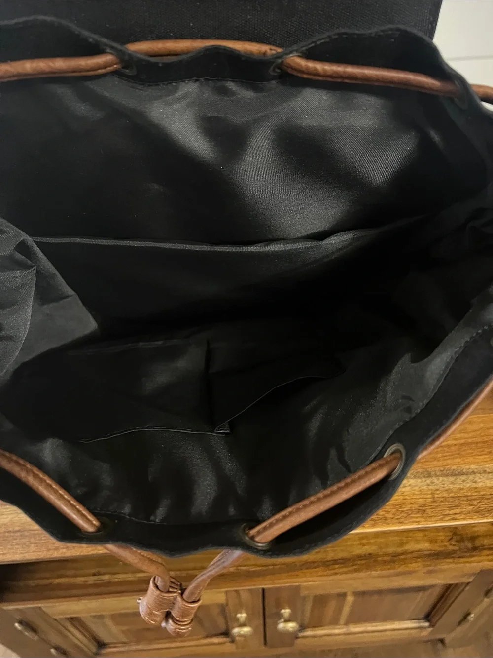 Vintage-Style Black Canvas Backpack with Brown Trim